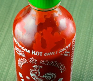 A bottle of the heat packed Sriracha sauce. THE PERFECT PANTRY BLOG